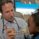 A doctor gives a child an asthma breathing test.